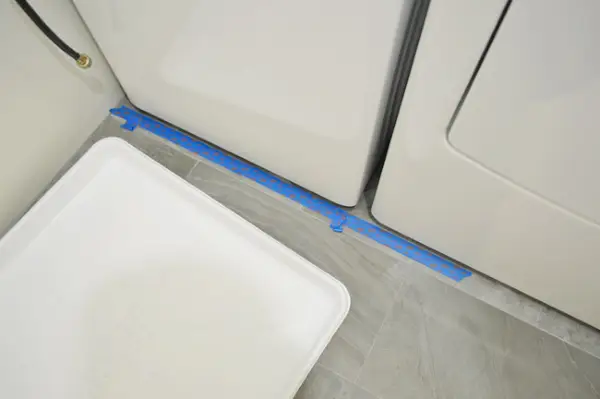 WasherIn 3 Tape op de vloer