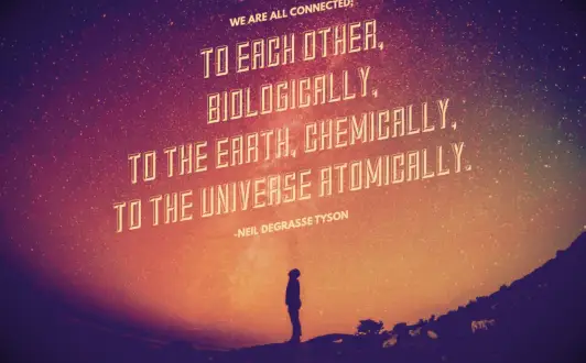 Neil Degrasse Tyson standing under the night sky admiring the bright stars