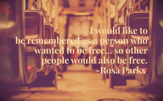The view down a row of bus seats and a Rosa Parks quote about freedom
