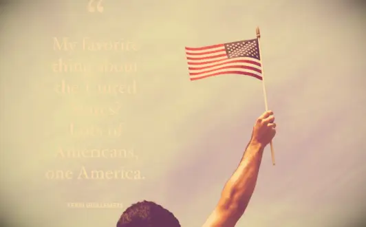 An outstretched arm waving an American Flag to celebrate diversity and unity