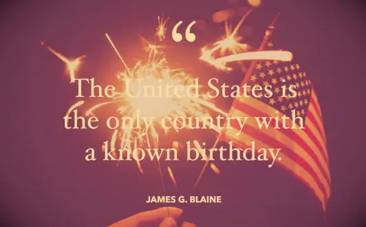 A small American flag and a lit sparkler to celebrate the Fourth of July