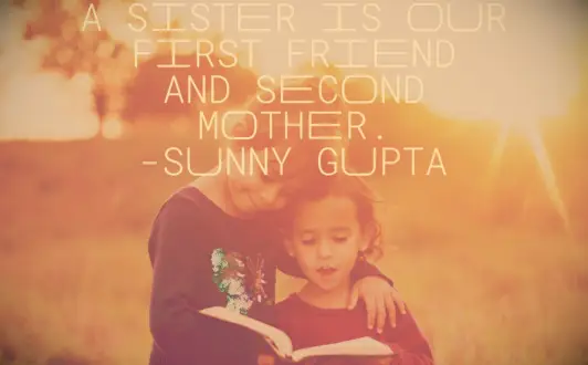 A big sister teaching her little sister to read from a large, leather-bound book