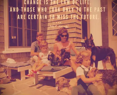 JFK and Jackie Kennedy playing with their two children and six dogs