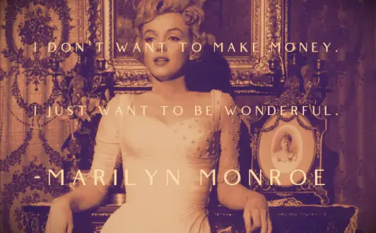 Marilyn Monroe in a form fitting white dress leaning against an ornate table