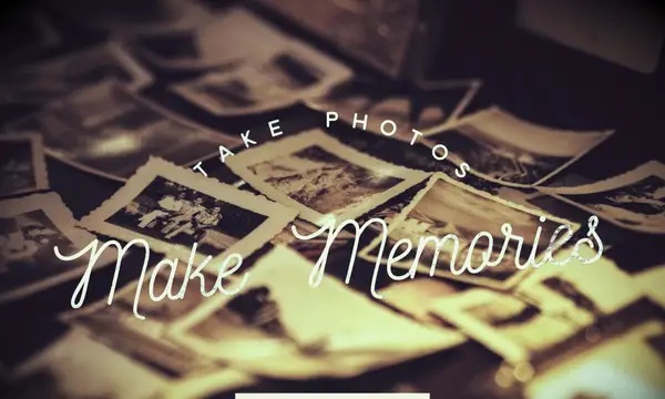 Dozens of old, black and white photos spread across a Thanksgiving table