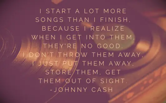 A large vinyl record with a smaller record on a turntable in the background