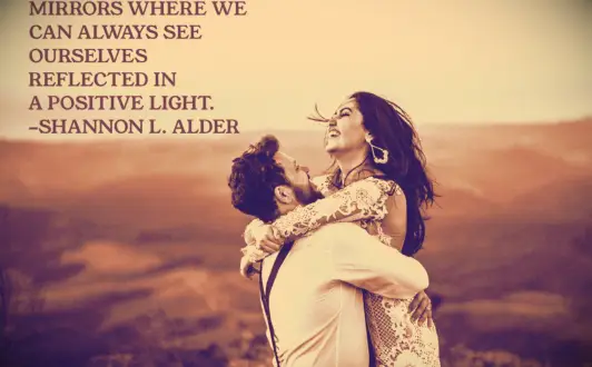 A man lifting and twirling his wife as they celebrate finding each other in life